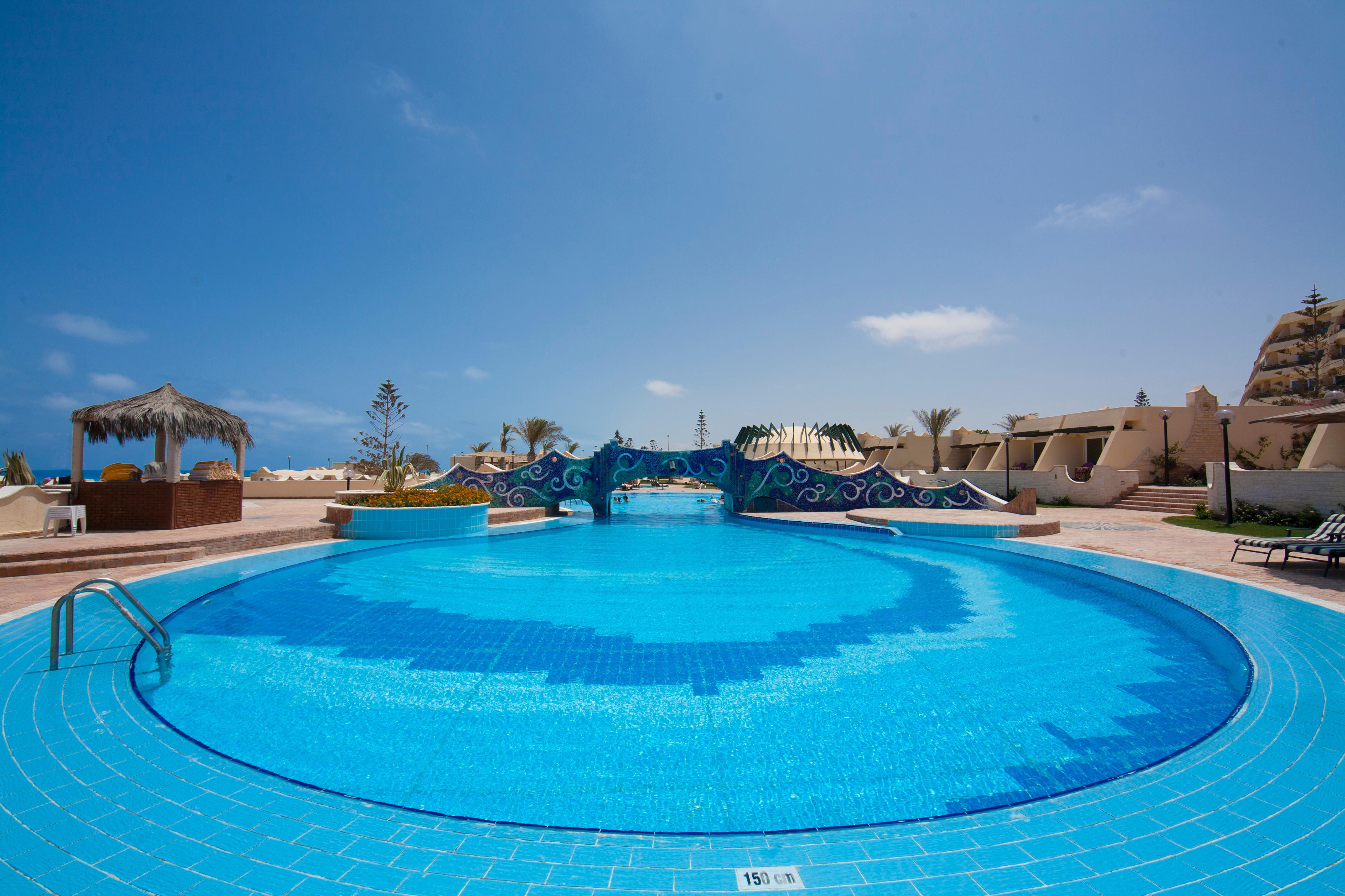 Borg El Arab Beach Resort Екстериор снимка A swimming pool at a resort in Egypt