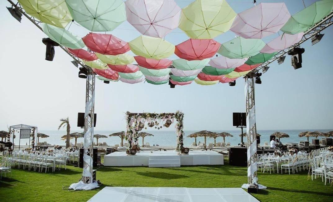 Borg El Arab Beach Resort Екстериор снимка A canopy of umbrellas