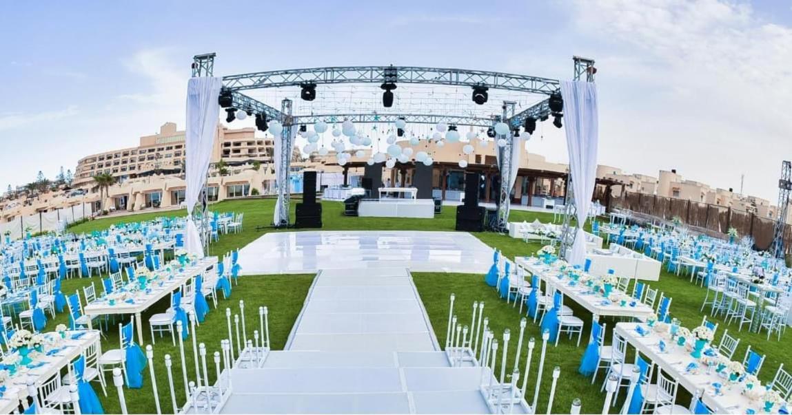 Borg El Arab Beach Resort Екстериор снимка The lawn at the Grand Hotel